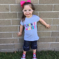 little girl wearing a shirt that says kindness matters