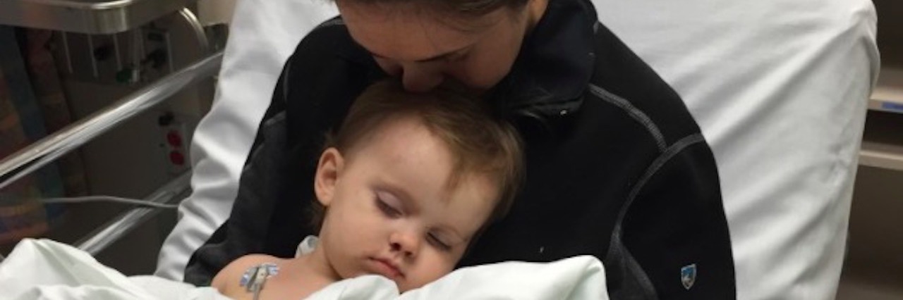Lauren holding her daughter in the hospital