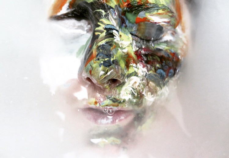 Face with one side covered in paint.