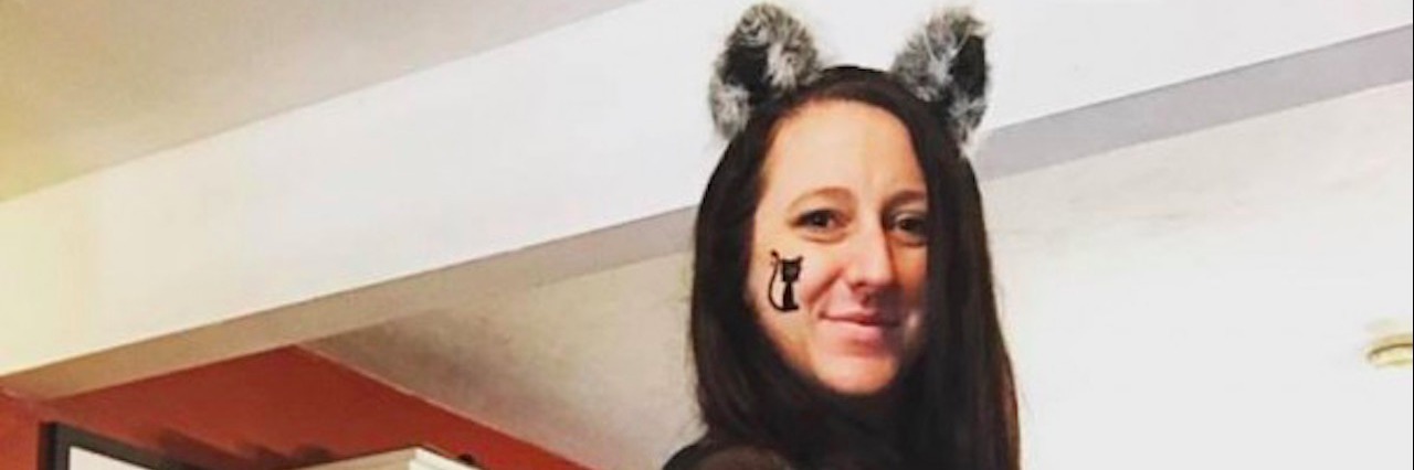 Why Mental Illness Shouldn't Be a Halloween Costume woman dressed as a cat
