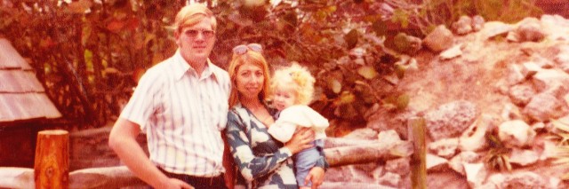 Karin with her parents, age 4.