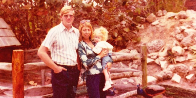 Karin with her parents, age 4.