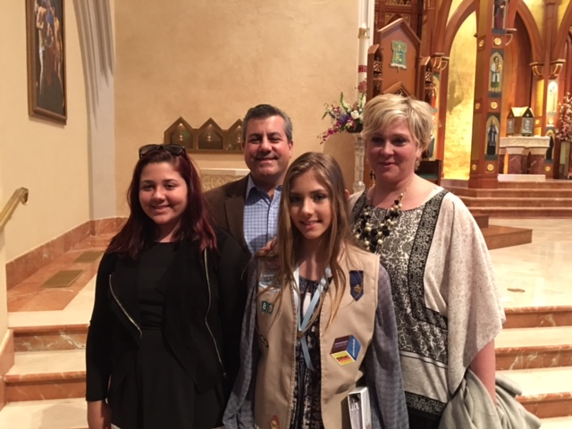 parents and two teenage girls in fancy room