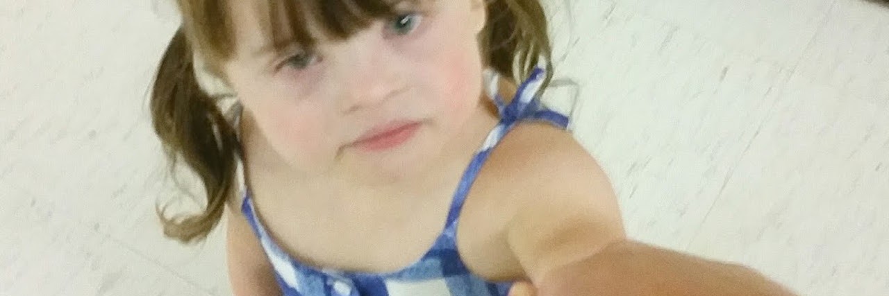 Giving My Daughter With Type 1 Diabetes Her First Insulin Shot little girl holding mom's hand