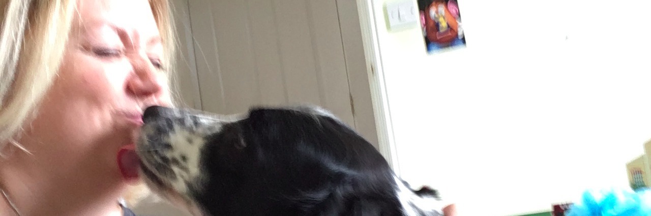 Health Benefits of Having a Pet If You Are Sick dog licking a woman on the face