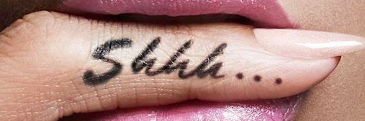 finger between womans lips with shhh... written on the side