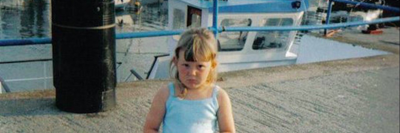 Learning You Might Have Autism as an Adult young girl holding toy standing on dock