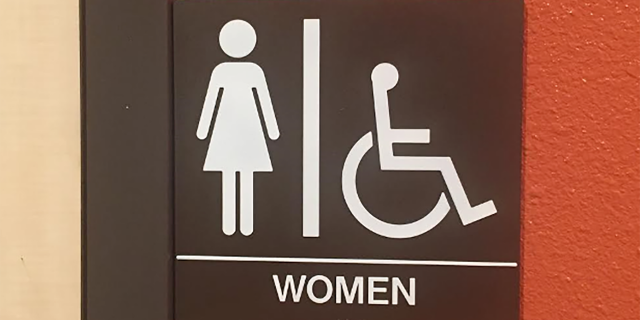 Women's bathroom sign.