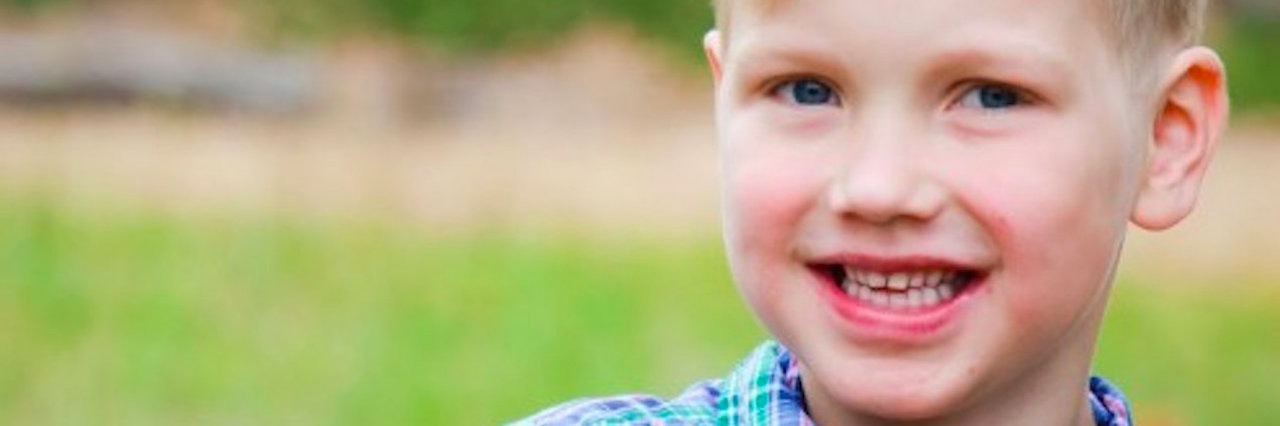 Congenital Heart Defect: Caring for My Son Is Like a Marathon boy in checkered shirt standing outside