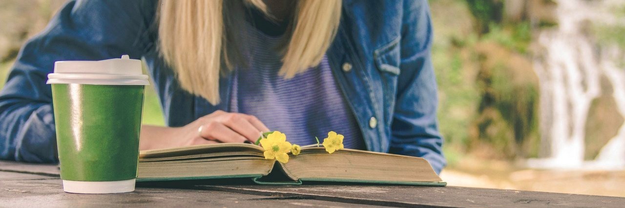 Keats Poem Shaped the Way I Approach Life With a Chronic Illness woman reading book outdoors