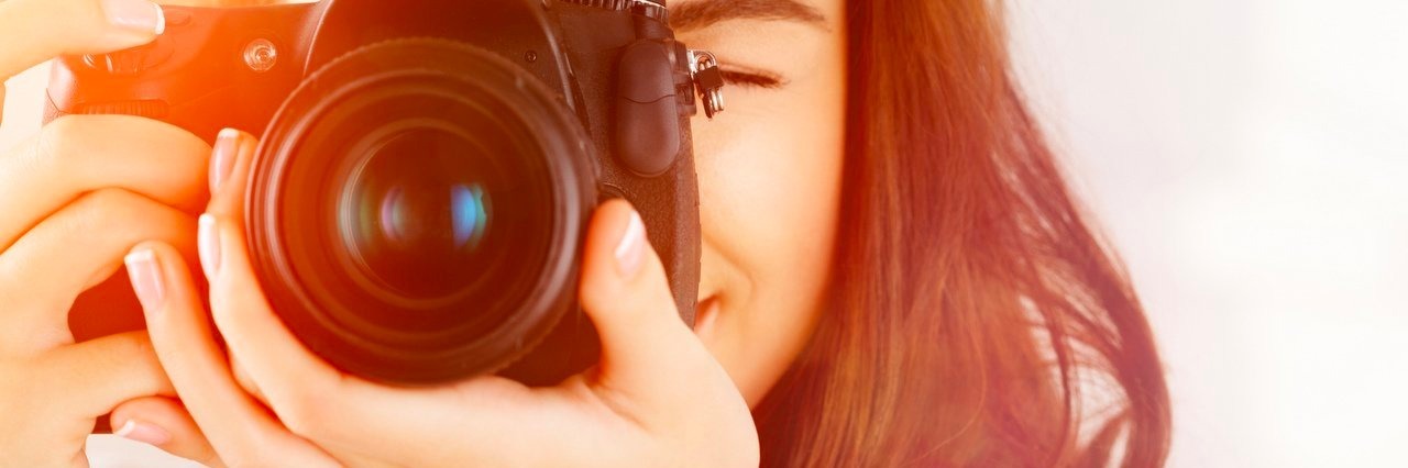 Taking Family Photos Made Me Realize It’s OK Not to Be Perfect woman taking a photo