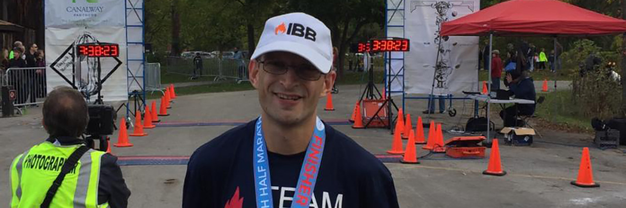Completing a Half Marathon as a Person With Cerebral Palsy At the Towpath Half Marathon finish line.