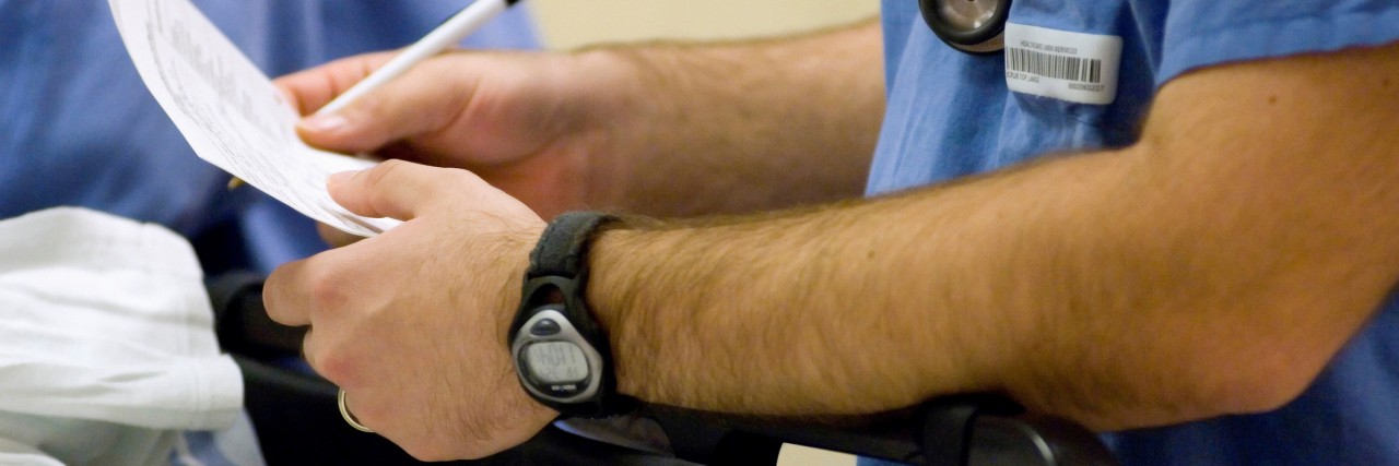 Crohn’s Disease: Comments by Medical Professionals Were Hurtful to Me physician writing notes while treating patient