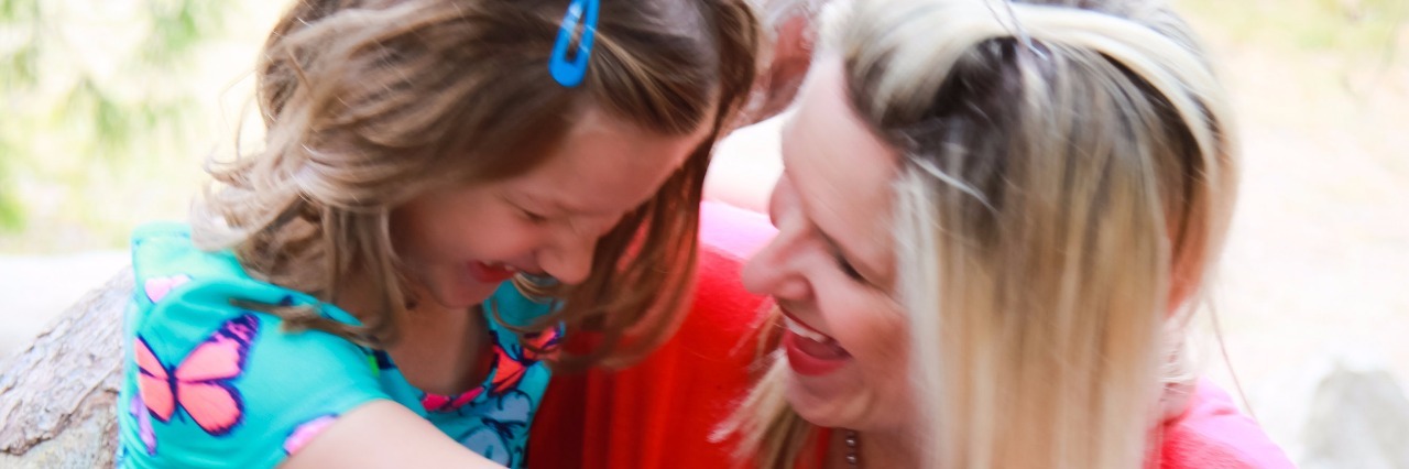 Being Diagnosed With ADHD at 40 After My Daughter's Diagnosis Mom and daughter smiling