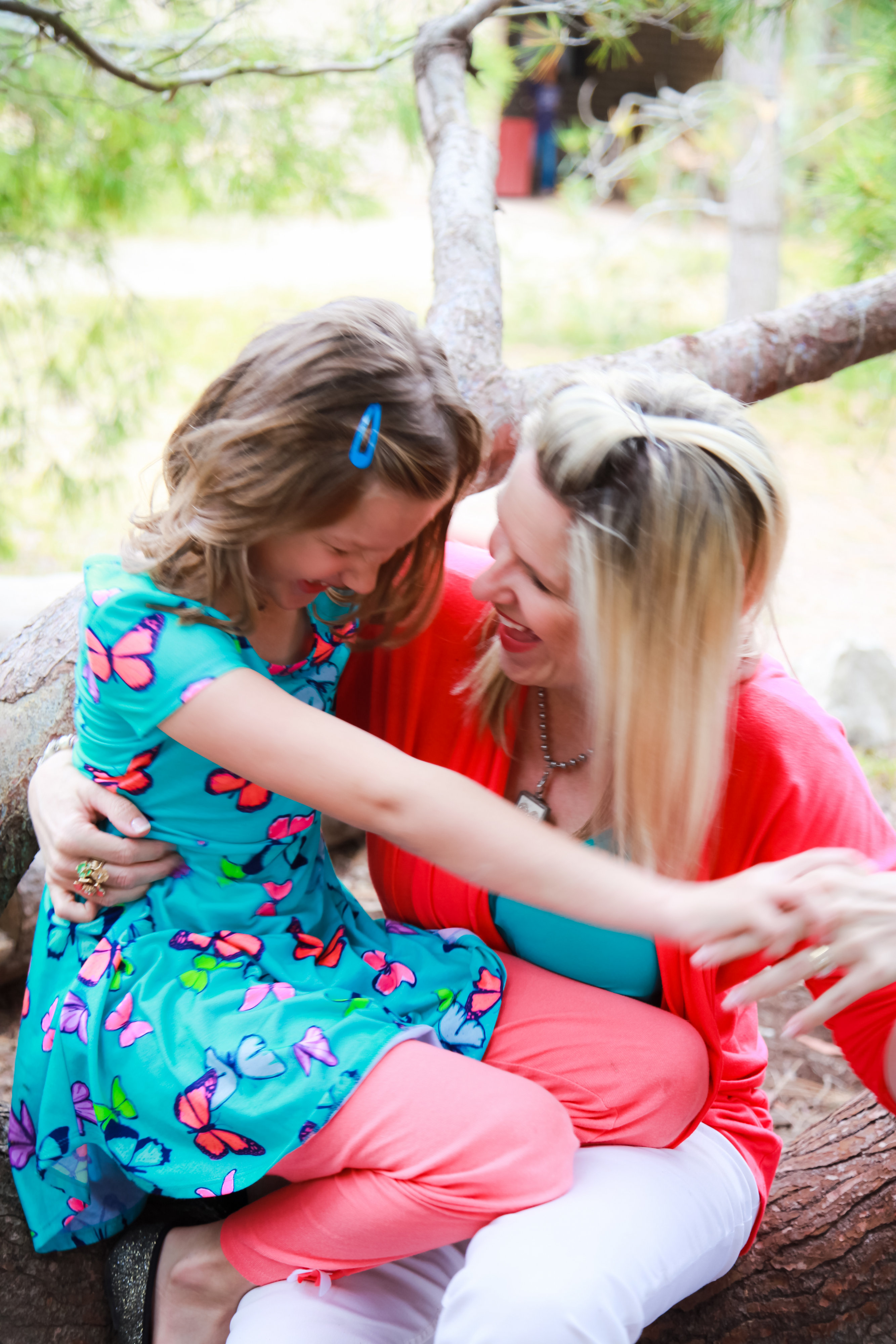 Mom and daughter smiling