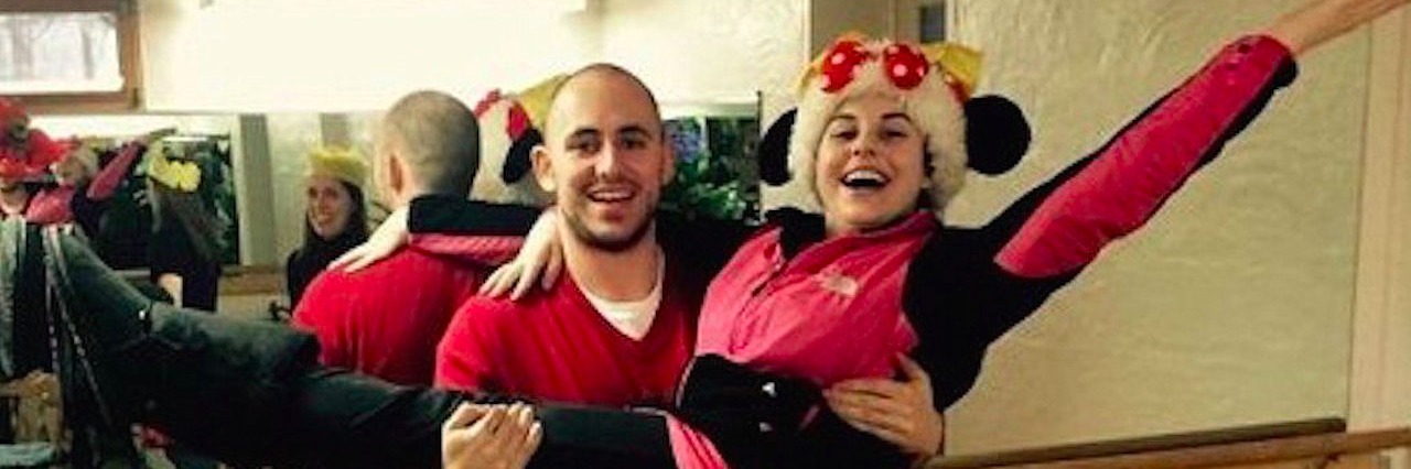 Woman With Lyme Disease Donates Holiday Gifts to Kids in the Hospital man lifts woman off her feet