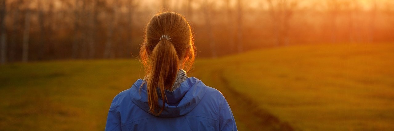 Letter to My Friend With Multiple Sclerosis Who Passed Away woman wathing the sunrise in a park