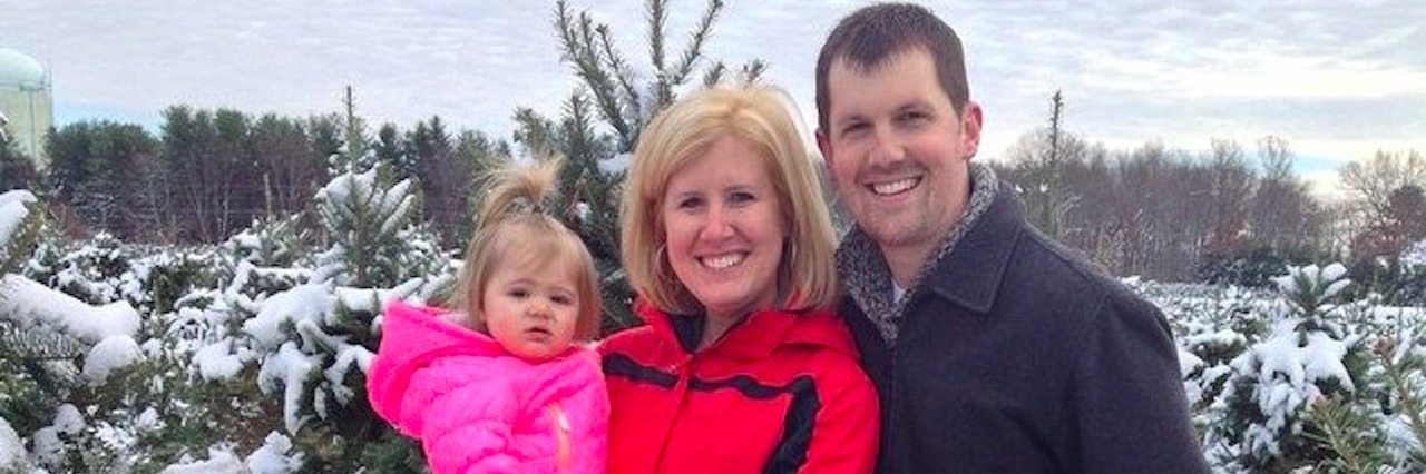 Woman Says Caretakers Like Her Husband Are Heroes in Her Book family posing with Christmas trees