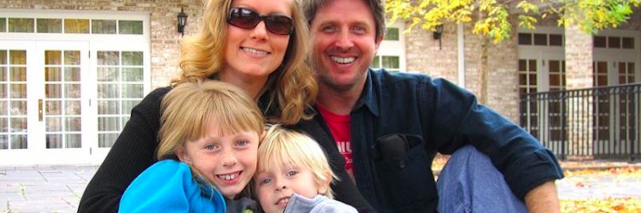 Pulmonary Embolism: What I Wish I'd Known a mother father and their two children sitting in front of their home in the fall