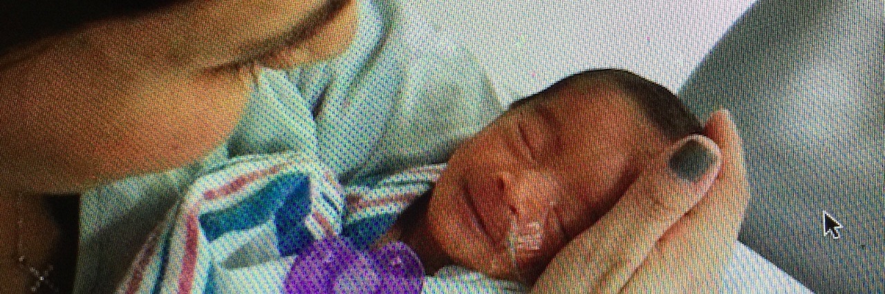 Prematurity: Why I'm Thankful for My Fellow Preemie Moms Mom holding her baby