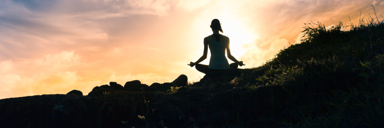 8 Self-Care Tips for Parents Who Have No Time for Self-Care a woman meditating at sunset