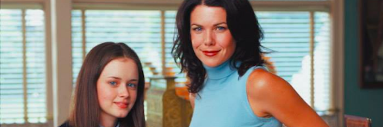 Why TV Shows Like 'Gilmore Girls' Should Talk About Mental Illness A young woman in a school uniform and a woman leaning her back against a counter in a cafe