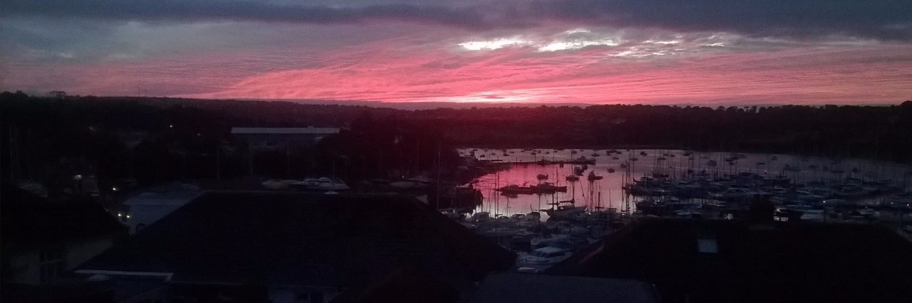 What Fatigue Feels Like view of pink sky over town