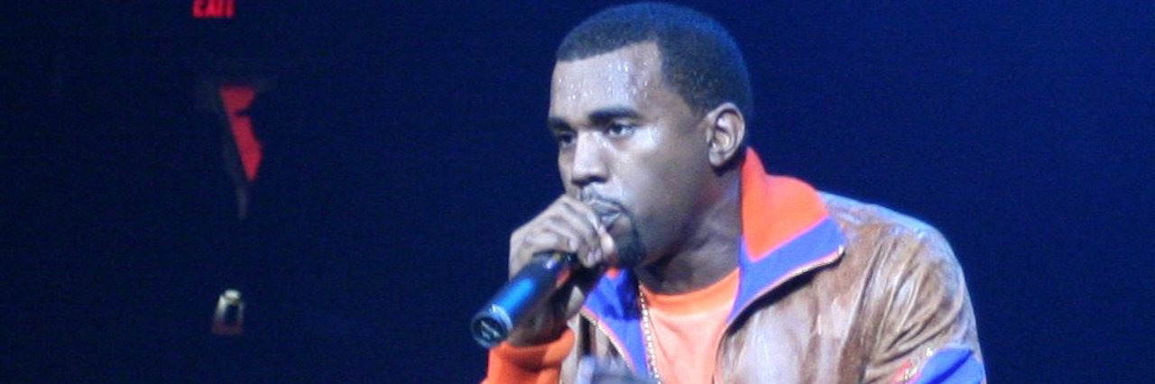 Kanye performing at a concert on stage