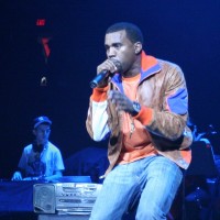 Kanye performing at a concert on stage