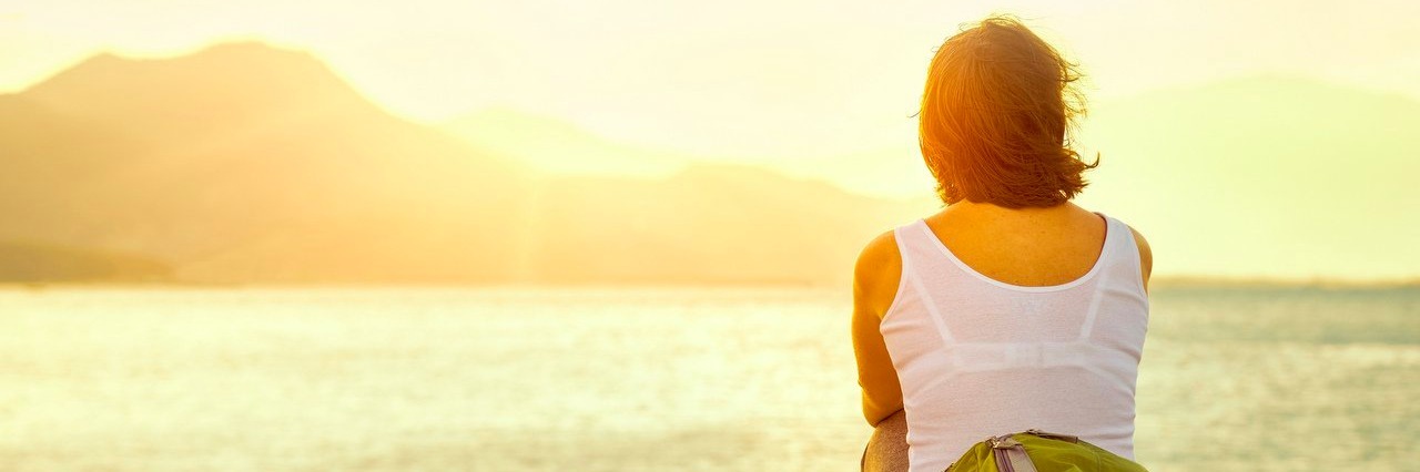 Reflex Sympathetic Dystrophy: Walking on a Beach Is Painful for Me young woman looking at an island