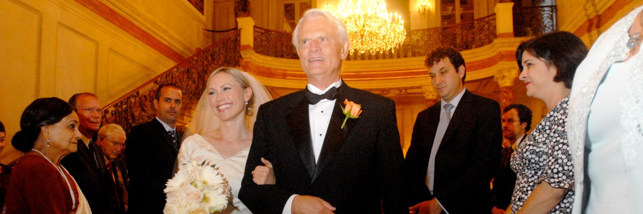 Learning to Not be Ashamed After a Parent's Suicide A bride walking down the aisle with her dad at her wedding