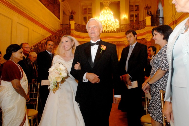 A bride walking down the aisle with her dad at her wedding