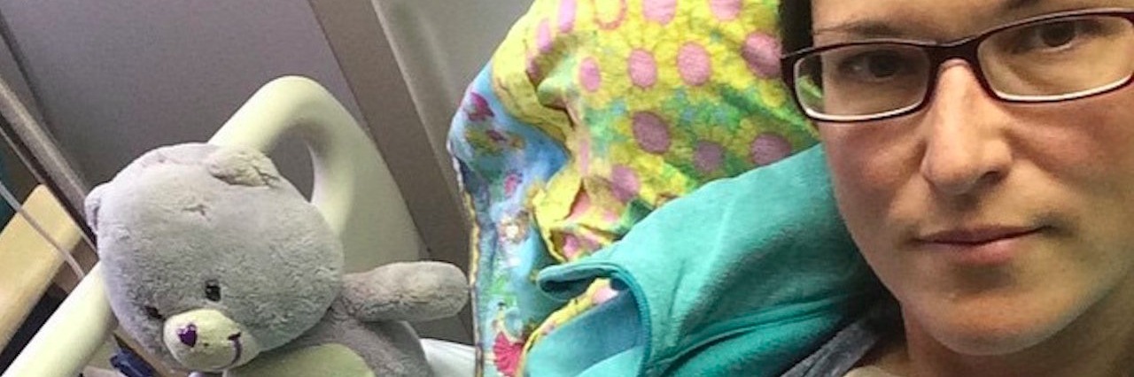 Woman With Pulmonary Hypertension Feels Guilty for Not Working woman in a hospital bed with stuffed animals