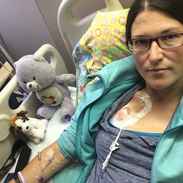 woman in a hospital bed with stuffed animals
