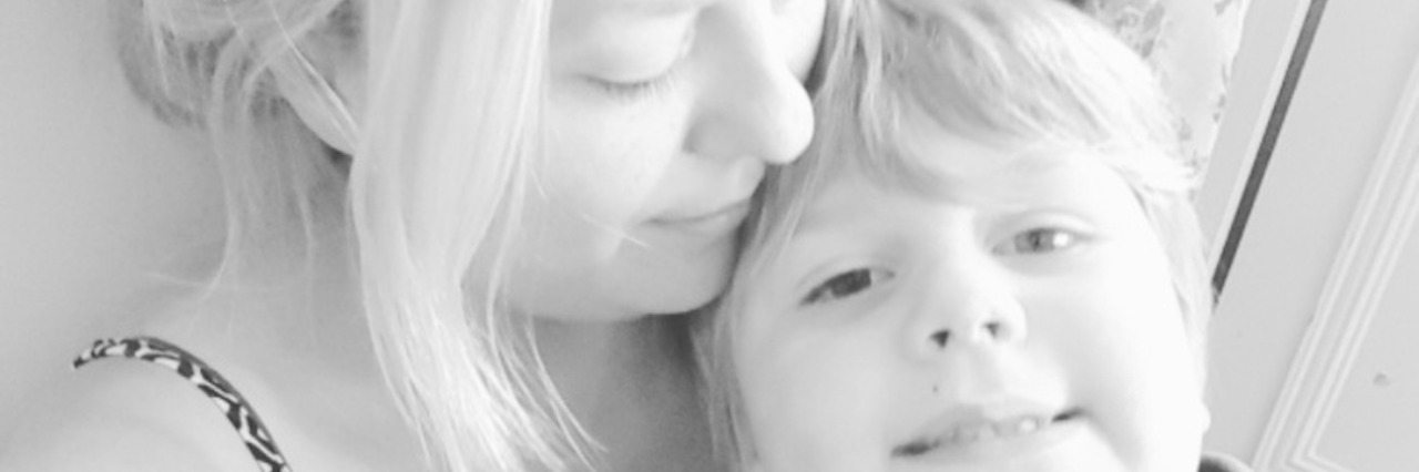 Autism: How My Son Helps Me Trust the People Caring for Him Black and white photo of mother holding son