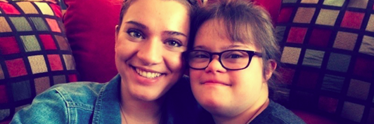 Down Syndrome: How Viral Videos Shape Popular Perception two sisters posing in their living room