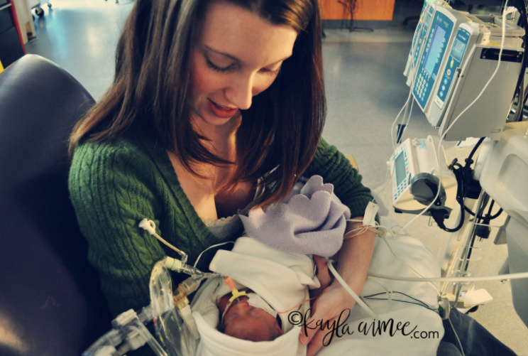 Mom holding her baby in the NICU