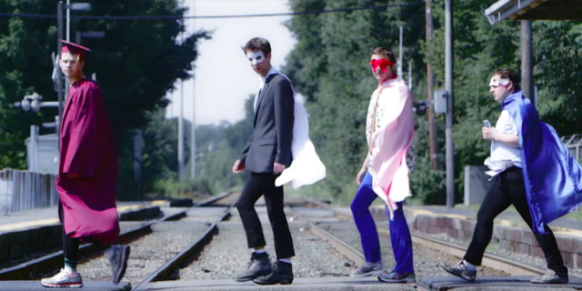 "Aspergers Are Us" Documentary Is Available on iTunes and Coming to Netflix Members of Aspergers Are Us dressed in costumes walking along a railroad track