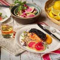 Photo of a salmon dish on a dinner table