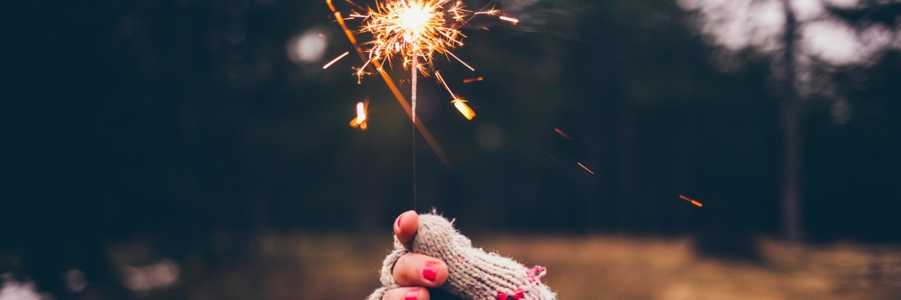 Uplifting Quotes to Spark Your Soul and See You Through Hard Times Hand in Glove Holding a Sparkler