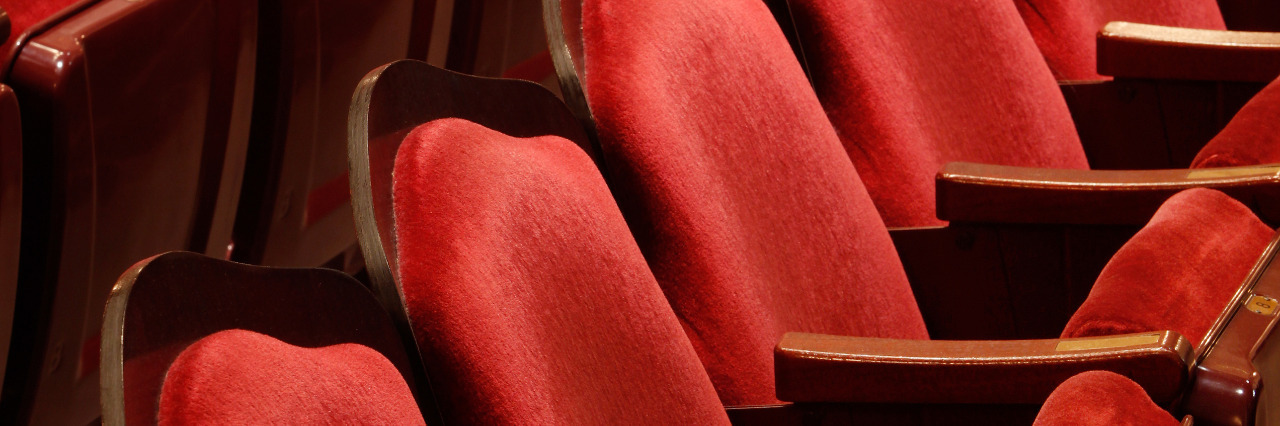 Don't Separate Me From My Wheelchair at Theaters Red theater seats.