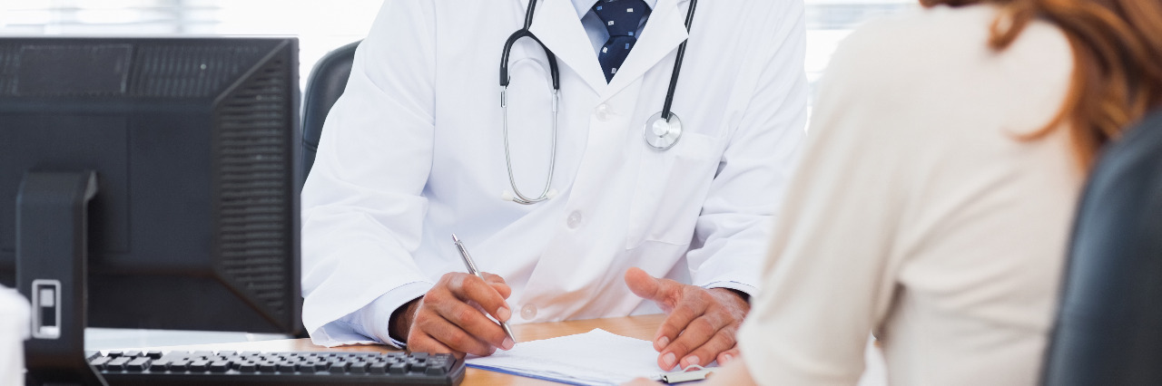 How a Diagnosis Helps After Years of Being Chronically Ill Doctor listening to his patient talking about her illness.