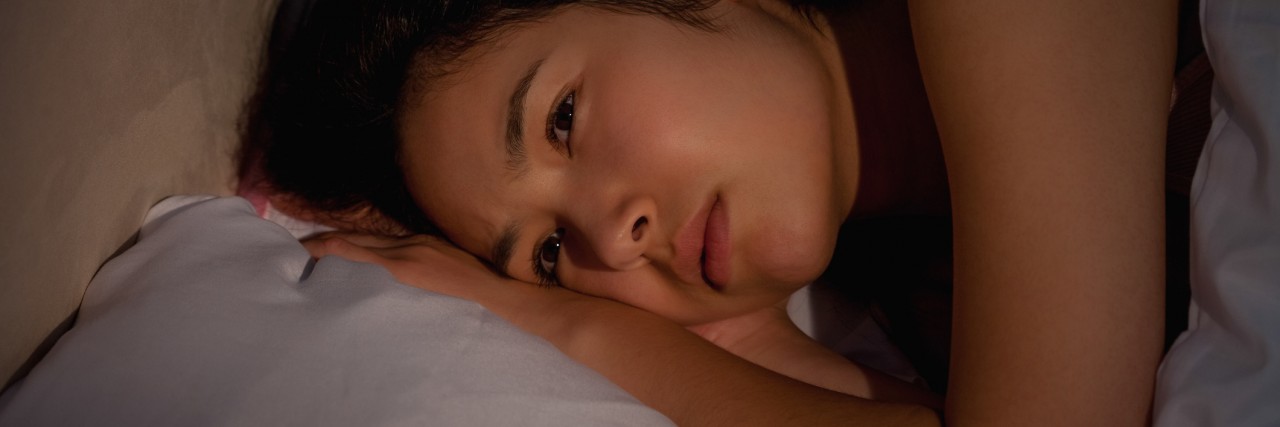 Letter to College Student Who's Suicidal and Self-Harms Young woman awake late at night