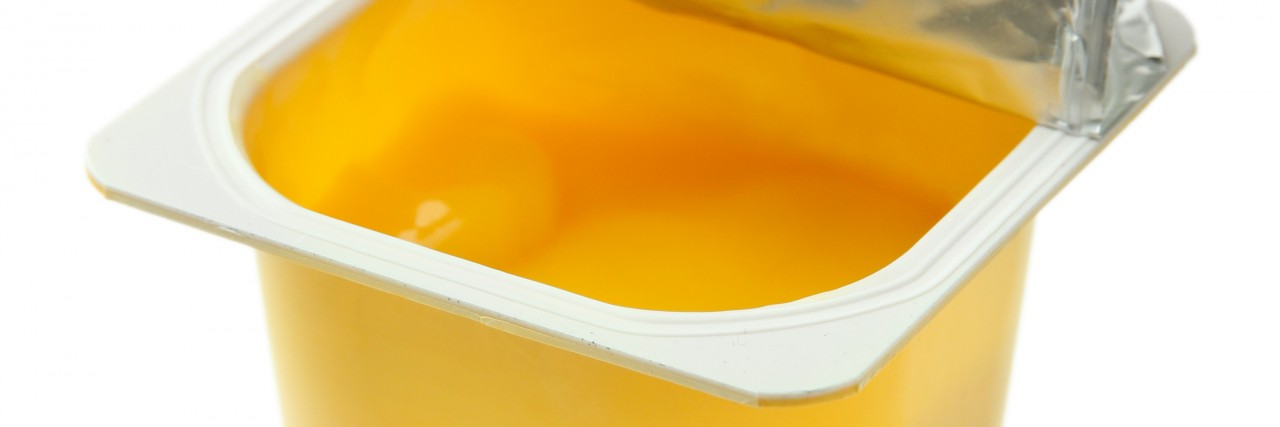 My Top Tips for Managing a Medical Diet Tasty yogurt in open plastic cup isolated on white