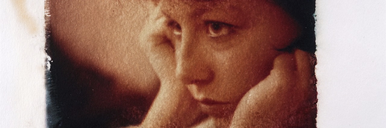 What Having Depression Is Like in Your 20s picture of a young woman looking sad