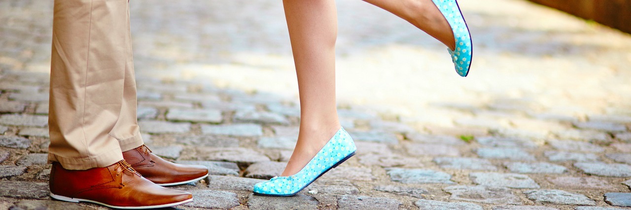 How Social Anxiety Keeps You From Dating Closeup of male and female legs during a date