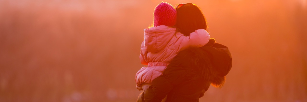 Being a Mom With Fibromyalgia Fog Mother and Daughter walk on a sunny winter day