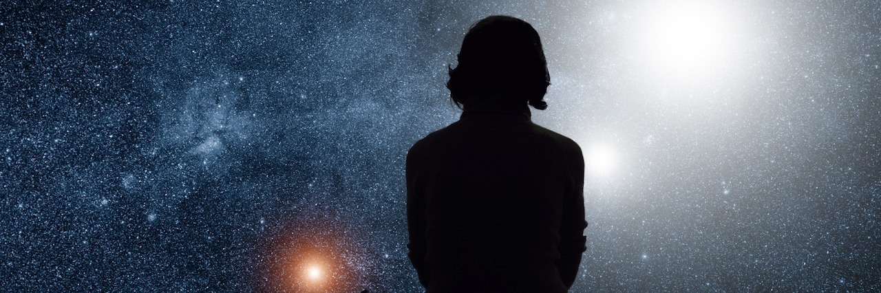 The Difference Between Major Depressive Disorder and Sadness person looking out at the stars