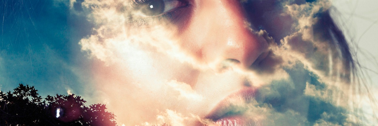 When You Hide Your Anxiety woman's face reflected off the sky