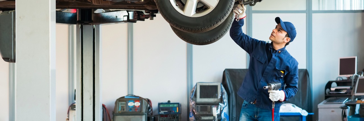 I'm Living a 'Normal' Life With Schizoaffective Disorder mechanic at work in his garage